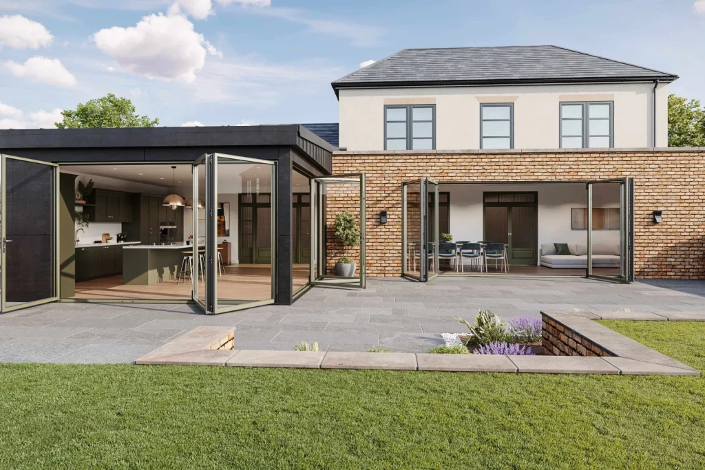 Modern home with large aluminium door solutions opening onto garden and outdoor seating area.