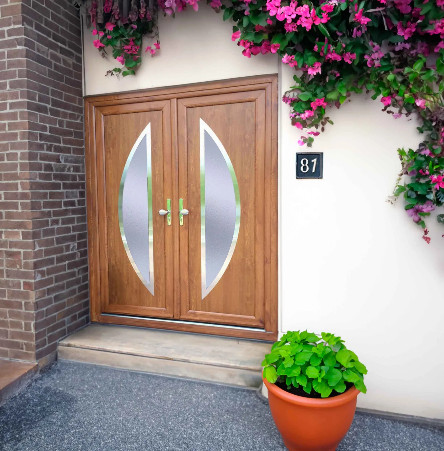 Rosewood uPVC double front doors installed on brick house entrance